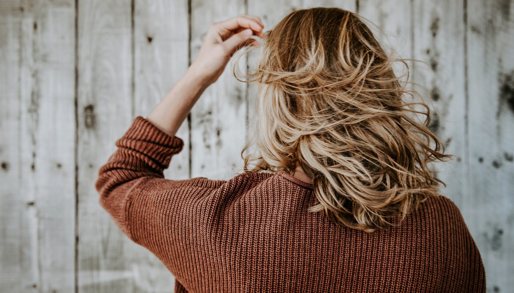 woman standing near board